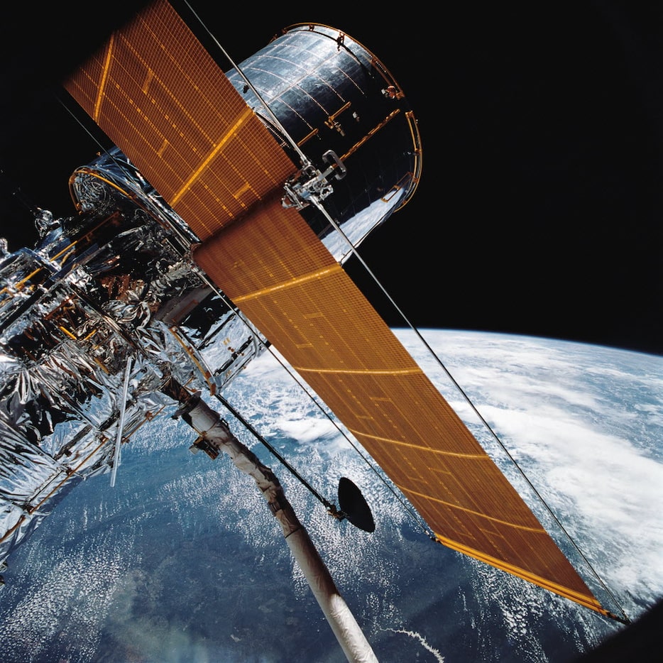 In this April 25, 1990 photograph provided by NASA, most of the giant Hubble Space Telescope...