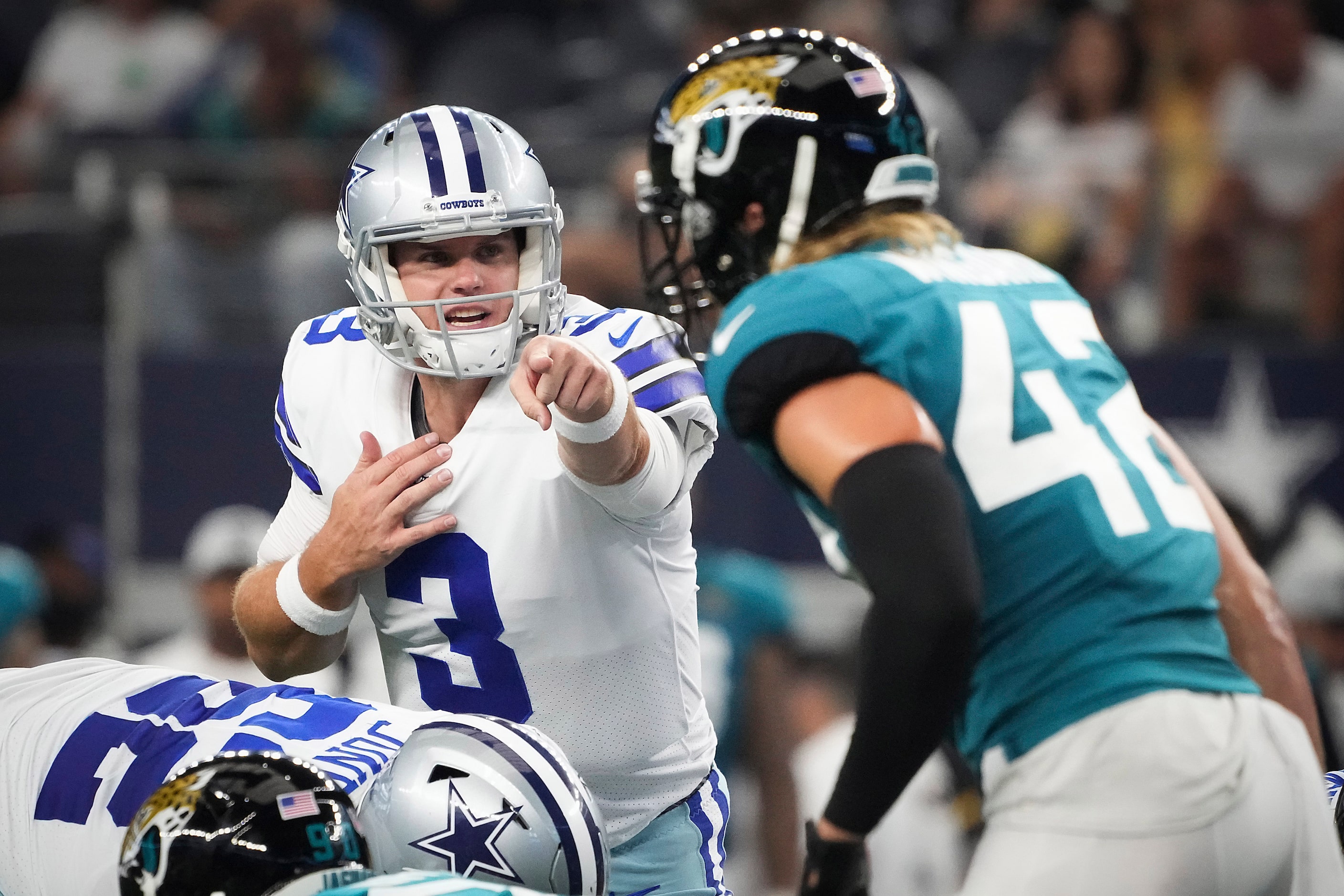 Dallas Cowboys quarterback Garrett Gilbert (3) points toward Jacksonville Jaguars defensive...