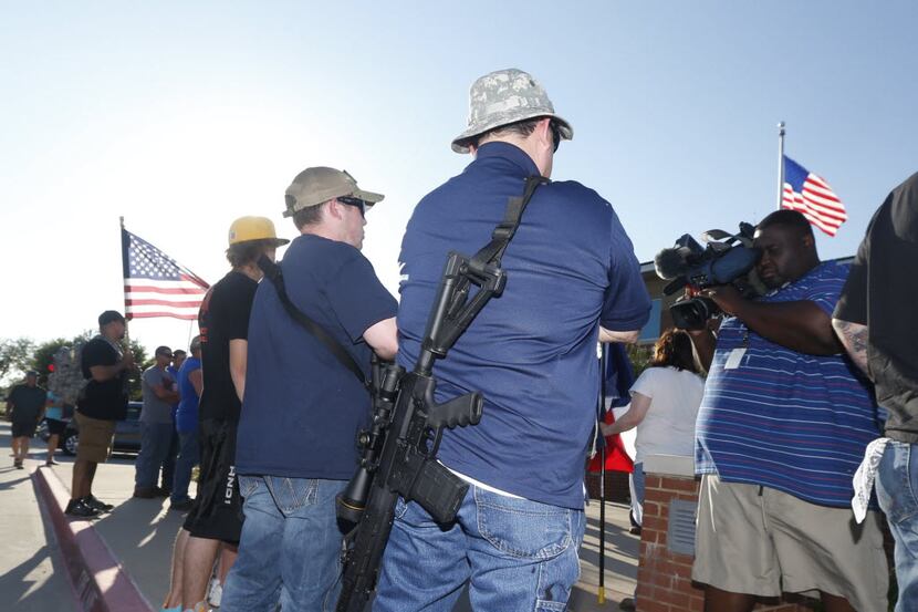 Open carry supporters attended a counterprotest in front of the McKinney Police Department...