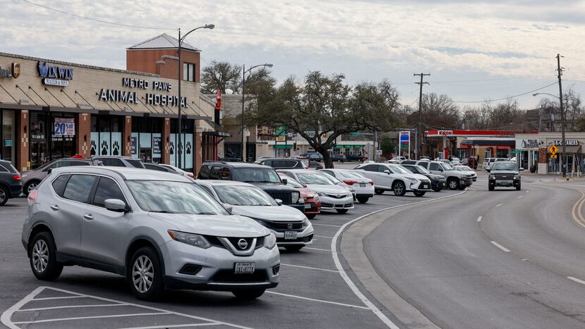 Cars sit parked along Skillman Street at the Skillman-Live Oak shopping center in Dallas....