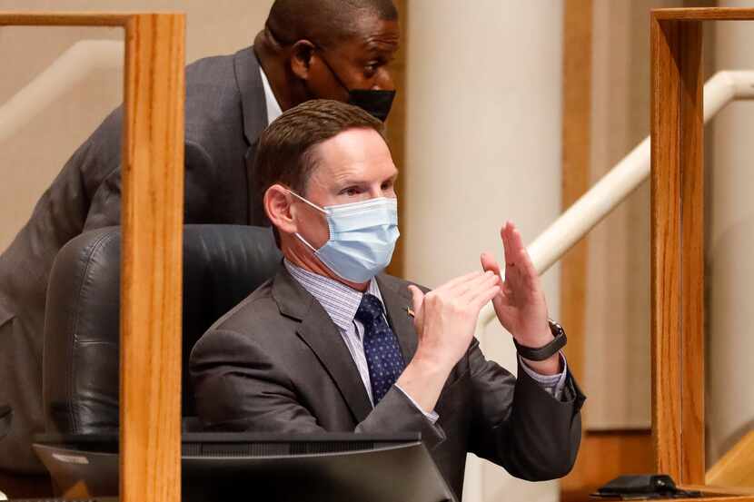 Dallas County Judge Clay Jenkins motions during a Dallas County Commissioners Court meeting...