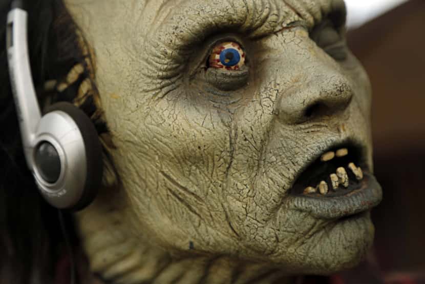 A monster mask sports headphones at the home of Ralph Granado Friday, September 28, 2012 in...