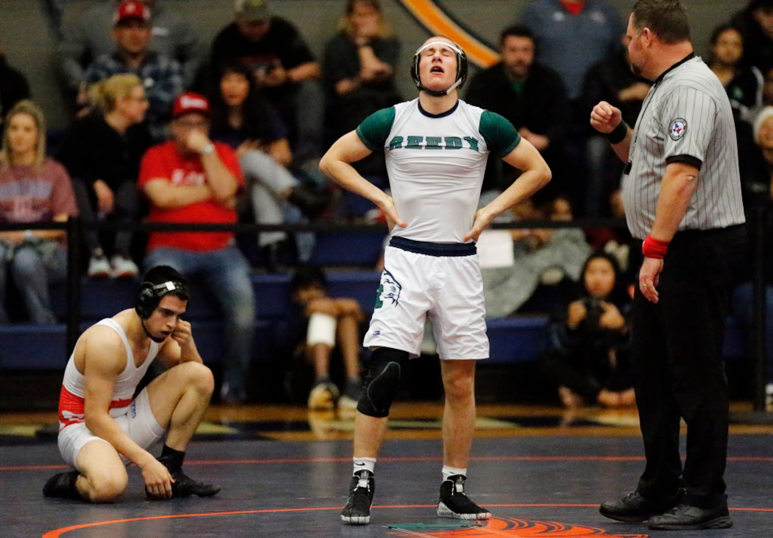 Tucker Spradley (center) of Frisco Reedy High School defeated Otto Rios (left) of Grapevine...