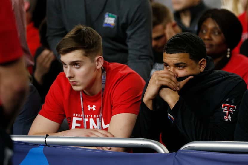Dejected Texas Tech Red Raiders fans late in overtime in the Final Four championship game of...