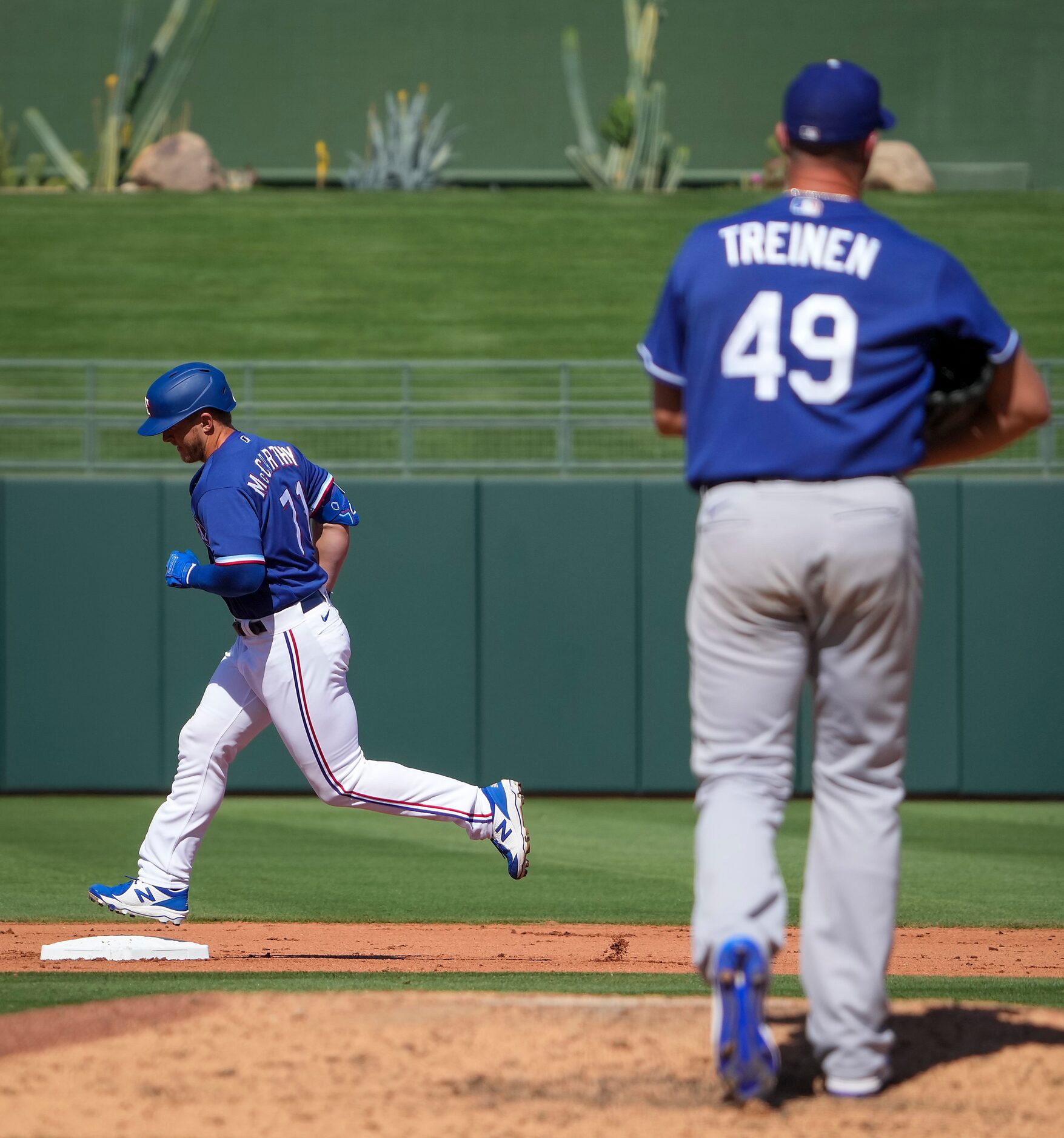 Texas Rangers designated hitter Joe McCarthy rounds the bases after hitting a home run off...