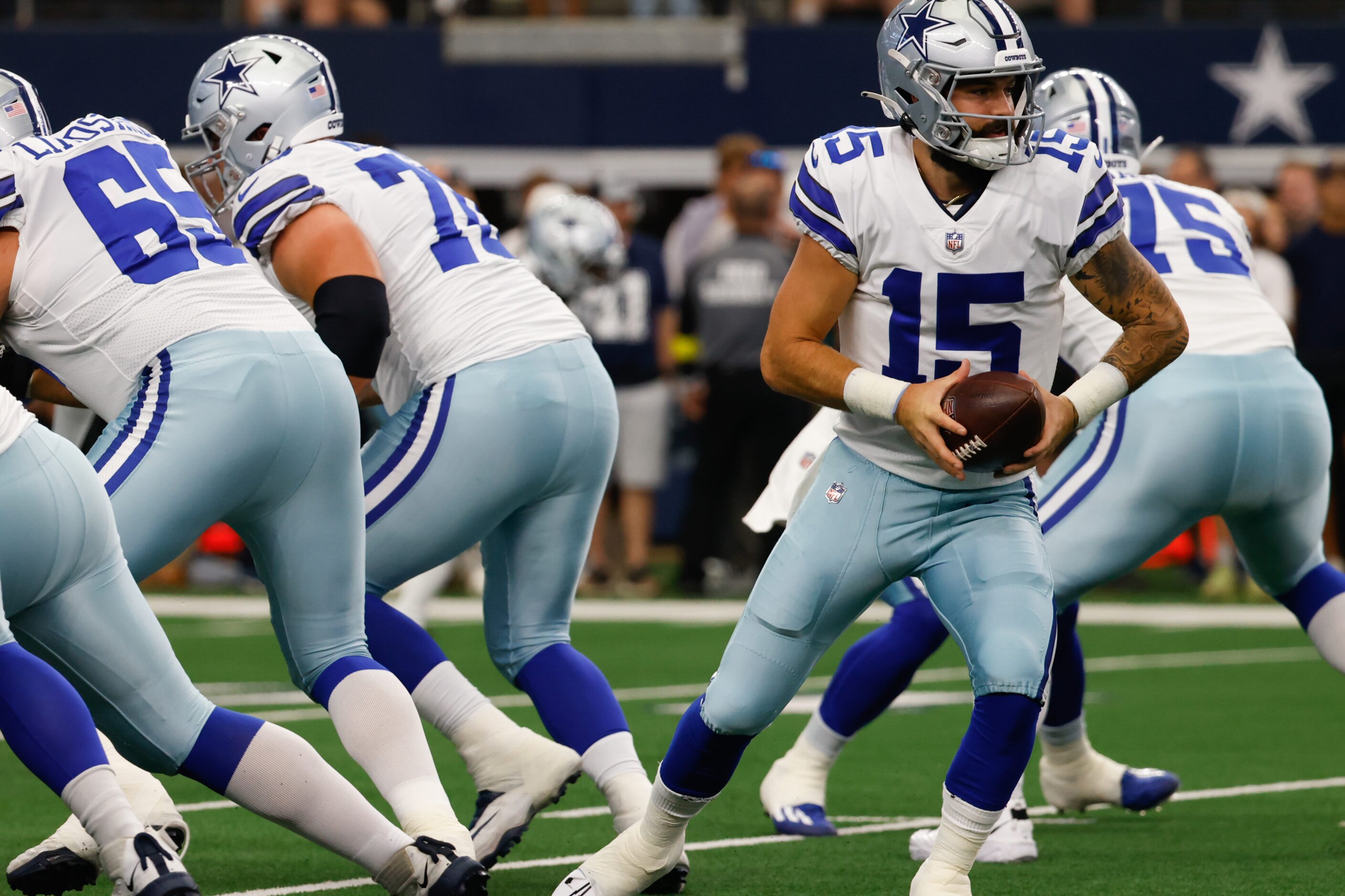 Dallas Cowboys quarterback Will Grier (15) during warmup before the game against Cincinnati...