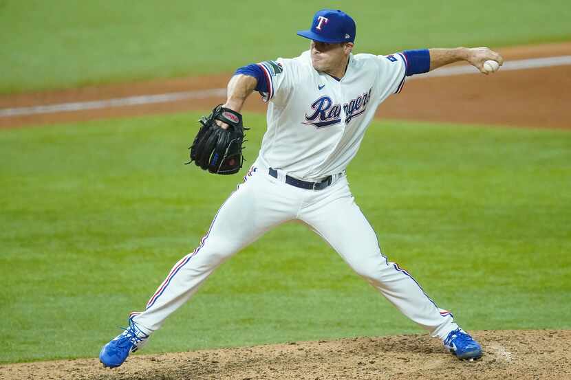 Texas Rangers relief pitcher John King delivers during the fifth inning of game two of a...