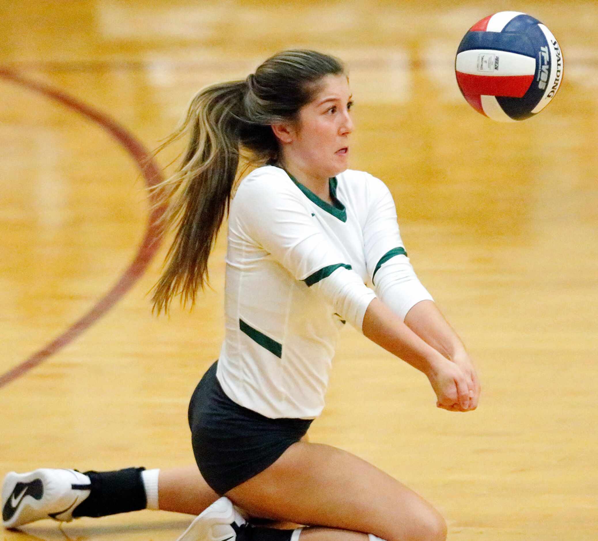 Lebanon Trail High School libero Lexi Abbey (4) fields a serve during game one as Heritage...