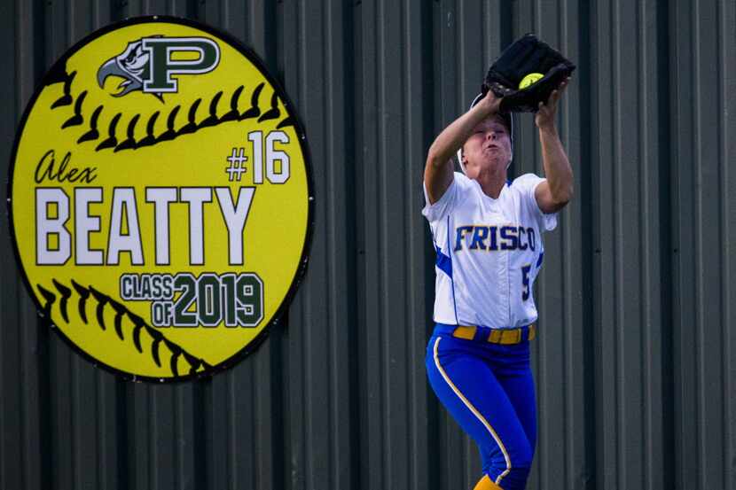 Frisco's Valerie Bennett (5) catches a fly ball in the outfield during the fifth inning of a...