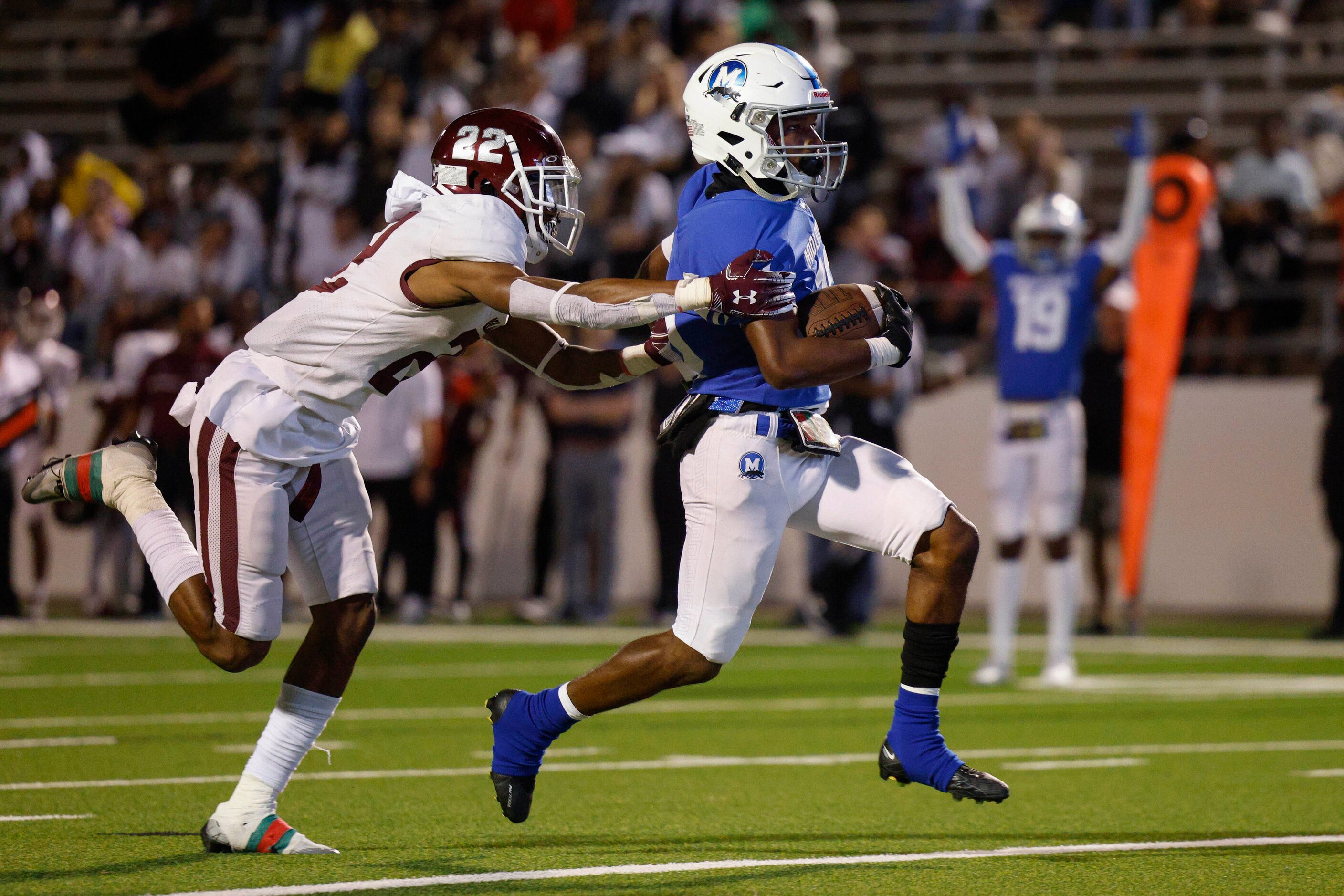 Red Oak defensive back Cam’ren Jones (22) reaches for Midlothian running back E.J. Milton...