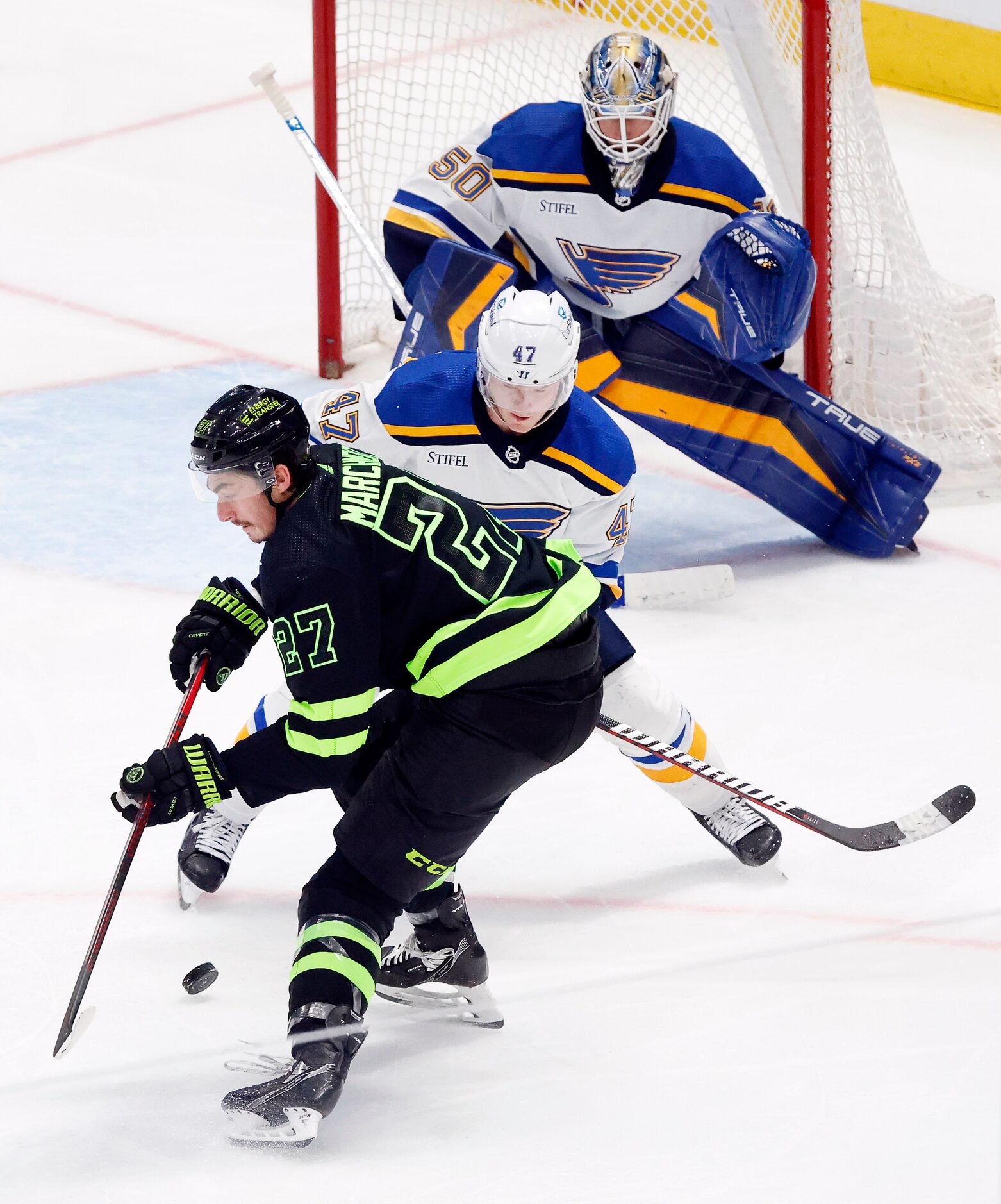 Dallas Stars left wing Mason Marchment (27) has the puck knocked away by St. Louis Blues...