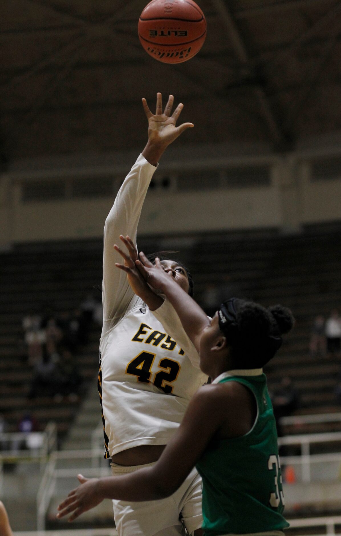 Plano East forward Idara Udo (42) puts up a shot as Southlake Carroll forward Jordan Sowell...