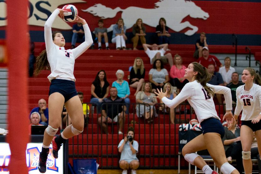 McKinney Boyd's Courtney Walters (3) sets the ball for teammate Paige Anderson (12) during...
