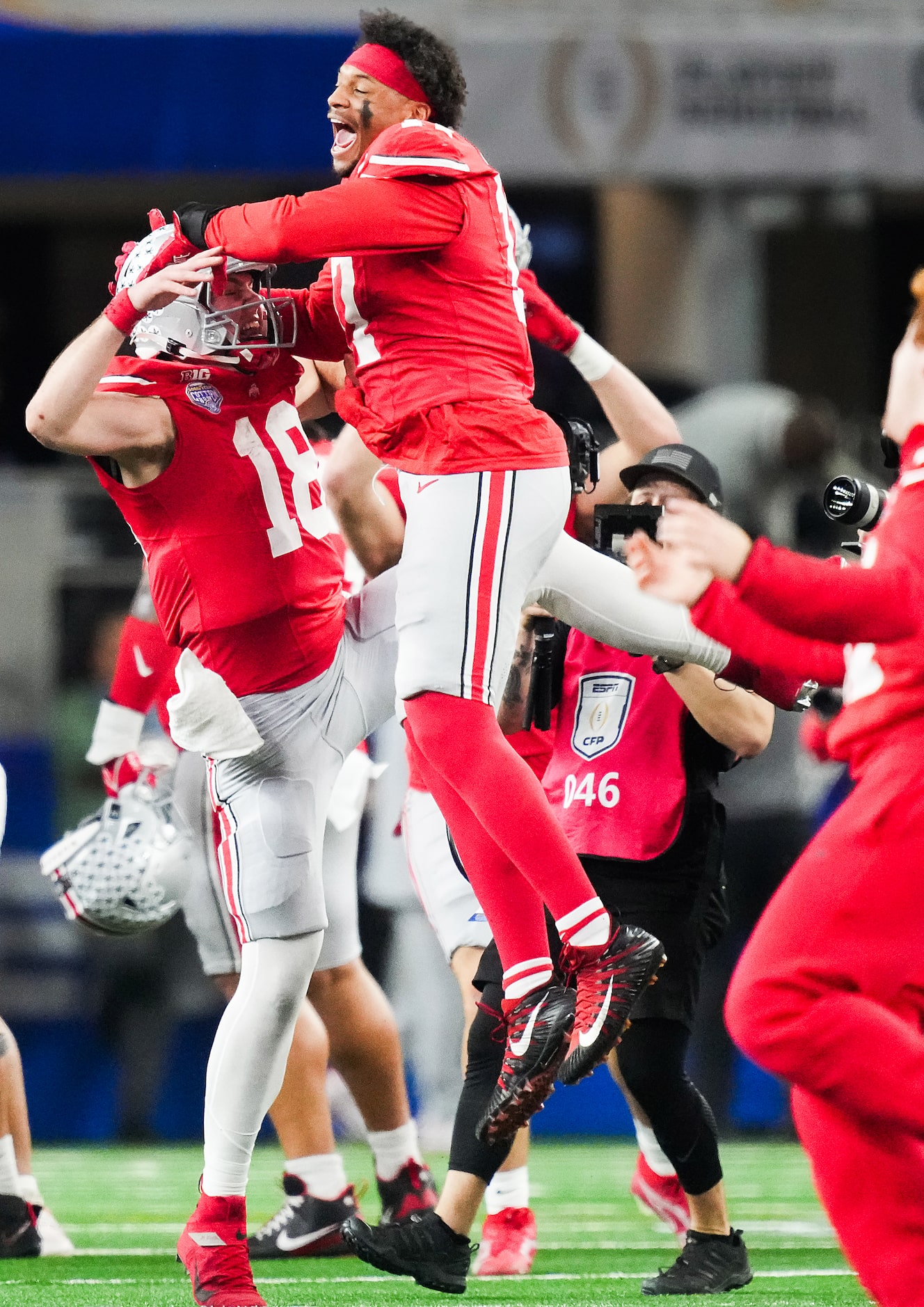 Ohio State quarterback Will Howard (18) celebrates with wide receiver Carnell Tate (17) as...