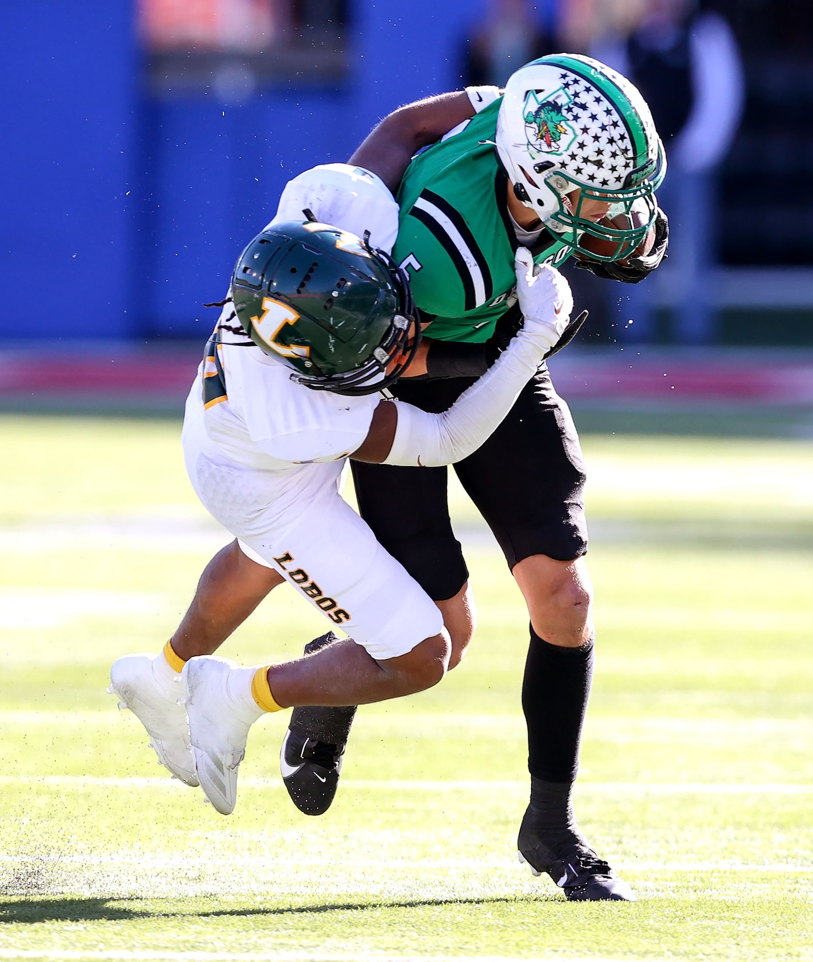 Southlake Carroll wide receiver Blake Gunter (5) tries to  break free from Longview...