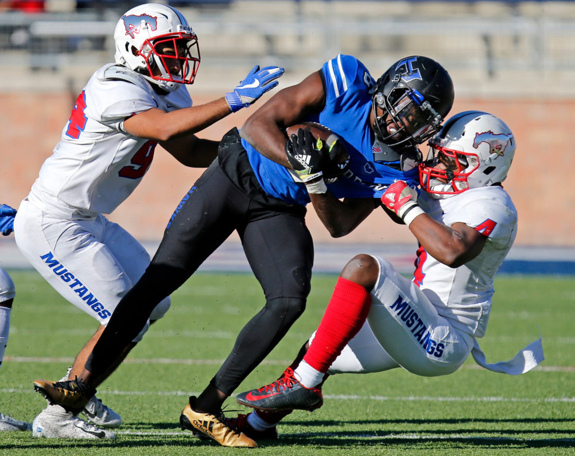 Hebron High School running back Jaylon Lott (6) is brought down by Pearce High School...