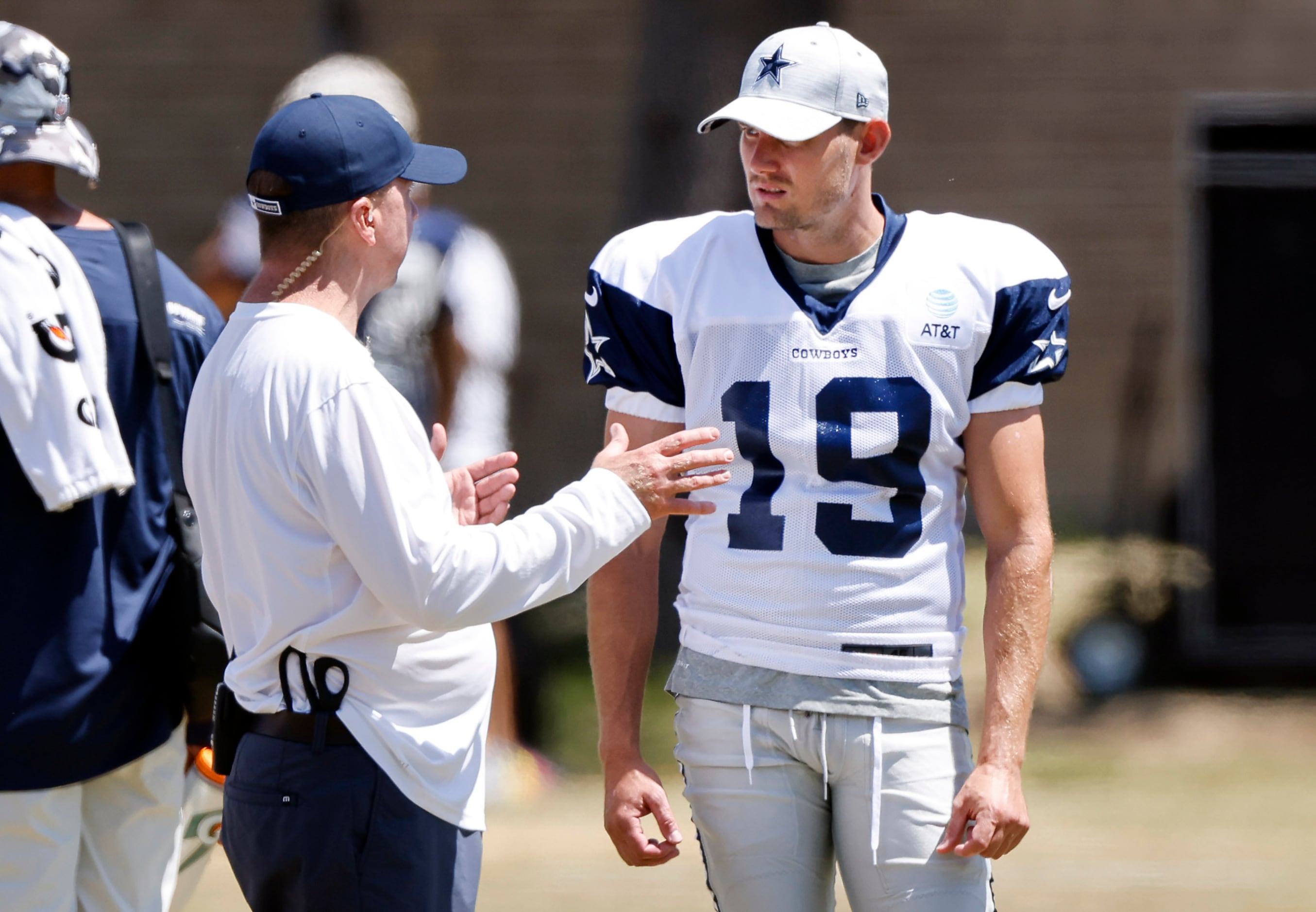 Dallas Cowboys newly singed kicker Brett Maher (19) visits with staff during training camp...