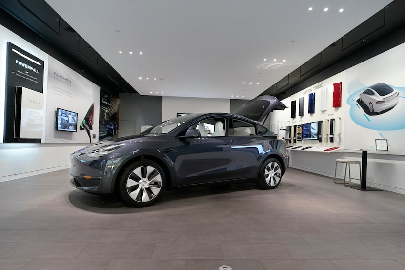 FILE - A Tesla Model Y Long Range is displayed on Feb. 24, 2021, at the Tesla Gallery in...