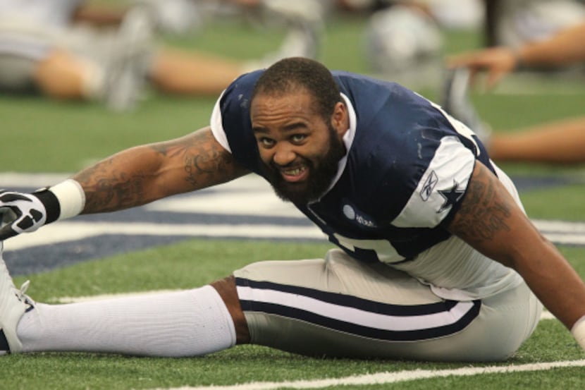Linebacker Anthony Spencer (93) stretches duirng Dallas Cowboys training camp at Cowboys...