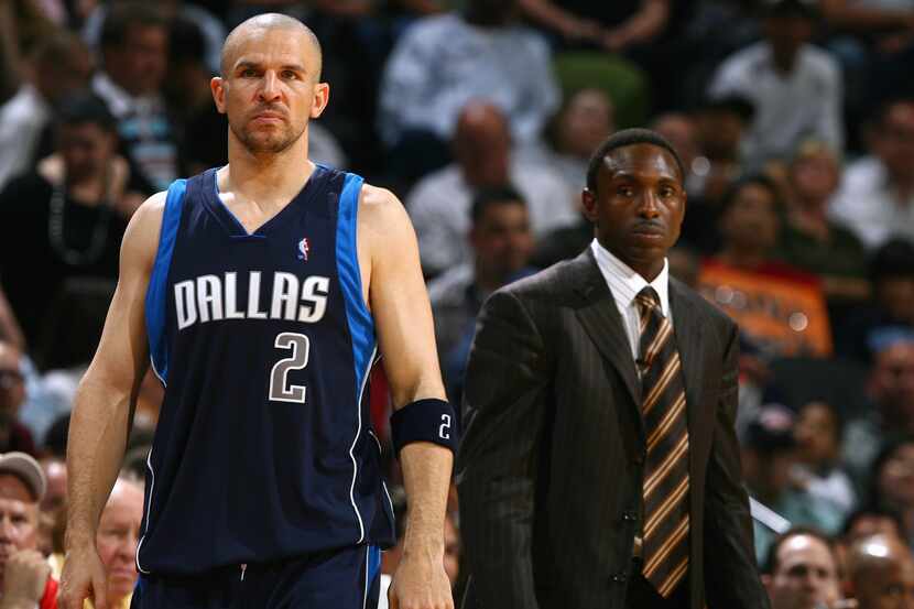 Jason Kidd and head coach Avery Johnson of the Dallas Mavericks look on during the game...