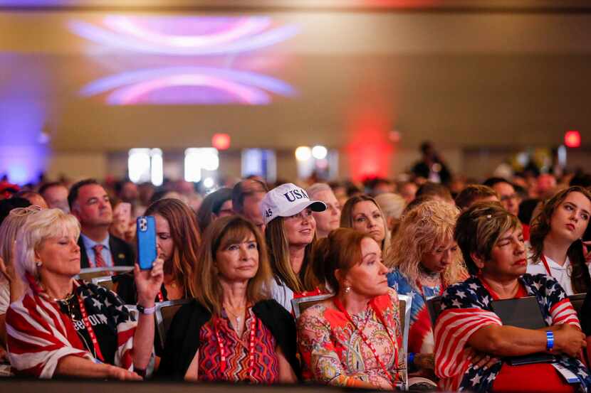 Attendees listen to remarks from Donald Trump Jr. at the Conservative Political Action...