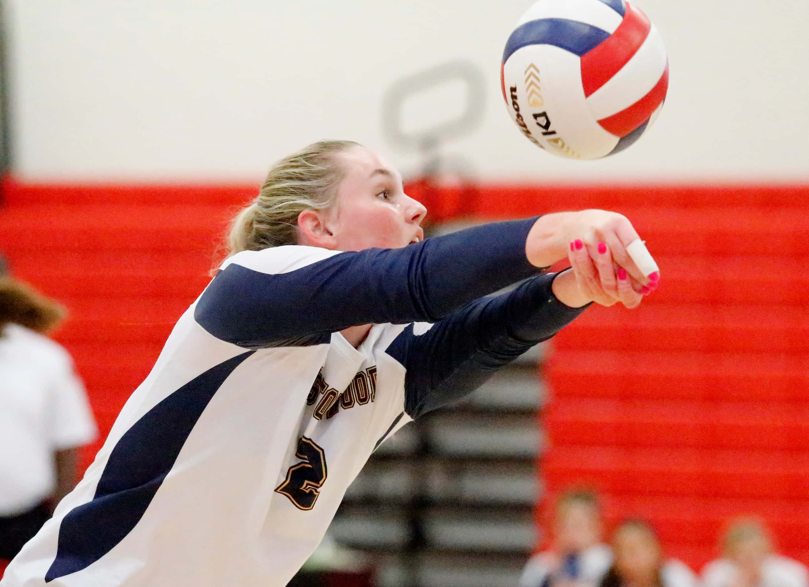 Prestonwood Christian Academy setter Camille Edwards (2) bump sets during game one as John...