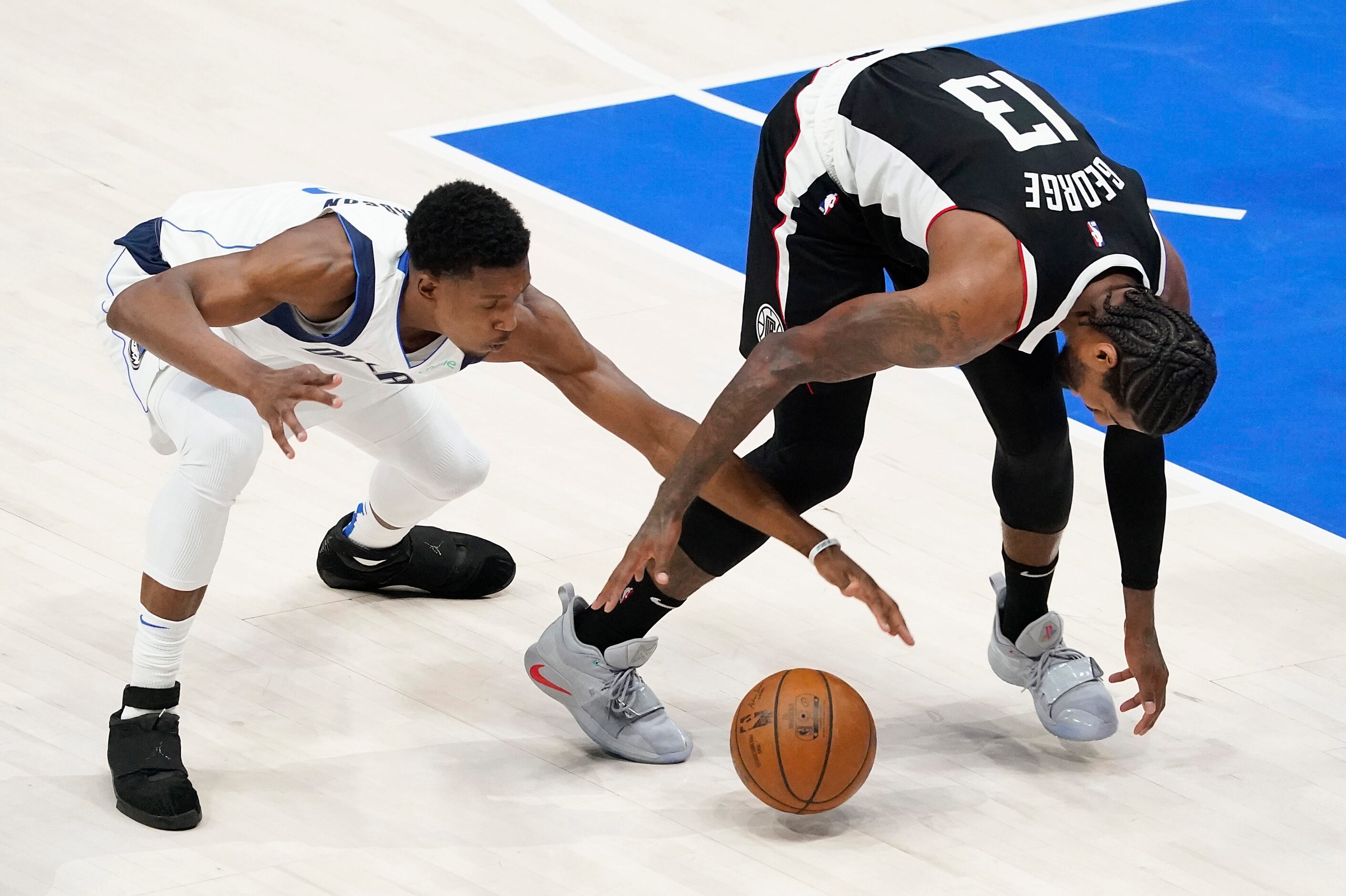 Dallas Mavericks guard Josh Richardson (0) fights for a loose ball with LA Clippers guard...