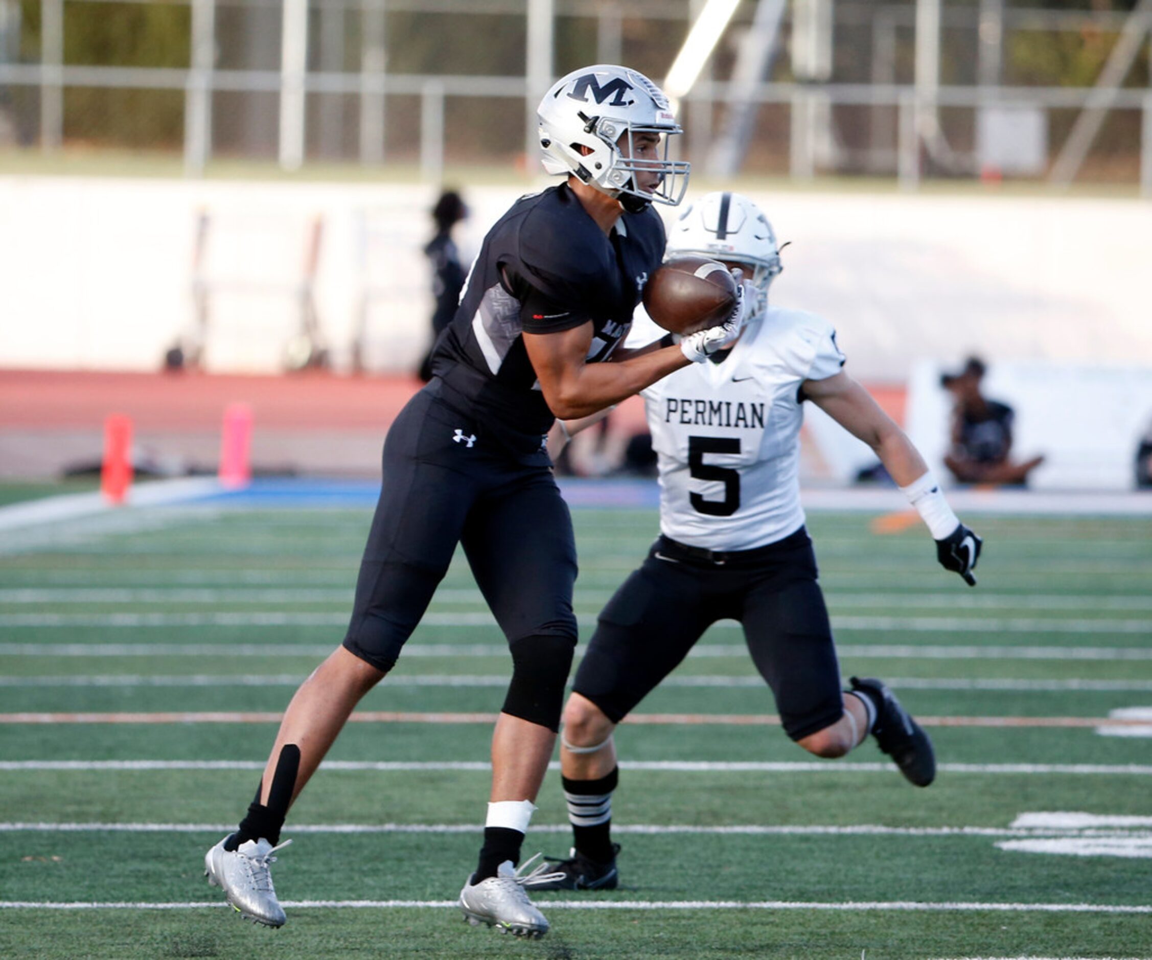 Arlington Martin receiver Sorrell Brown (19) catches a pass in front of Odessa Permian...