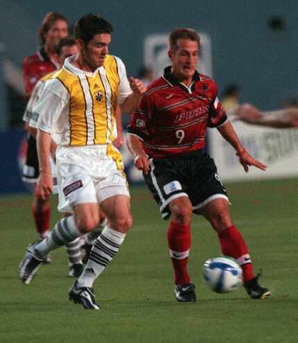 (right) Dallas Burn's Jason Kreis, #9, in action during a game against Columbus Crew.