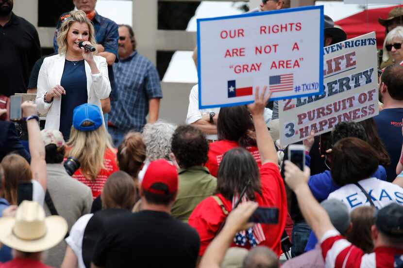 Shelley Luther, owner of Salon a la Mode in Dallas, speaks to the crowd during the Set...