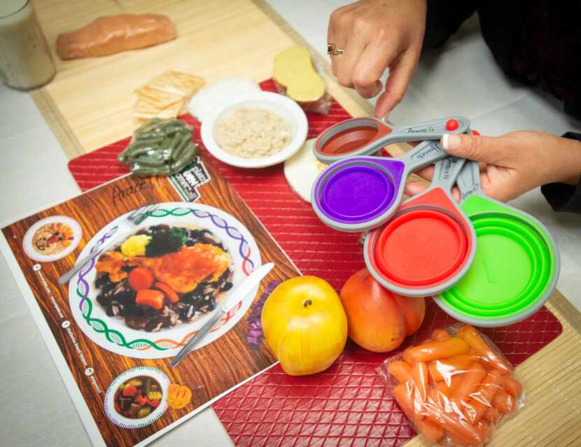 Dietitian/nutritionist Araceli Vazquez demonstrates the color-coded diet plan she created...