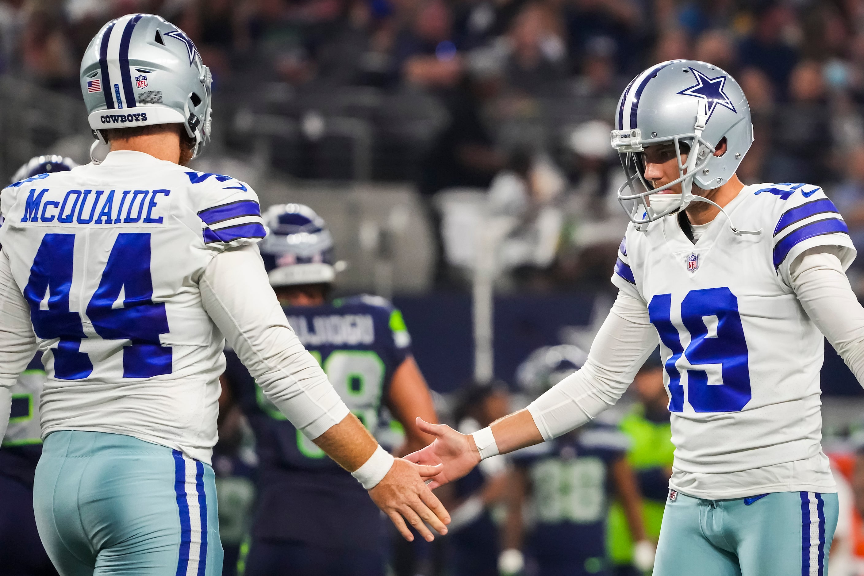 Dallas Cowboys place kicker Brett Maher (19) celebrates with long snapper Jake McQuaide (44)...