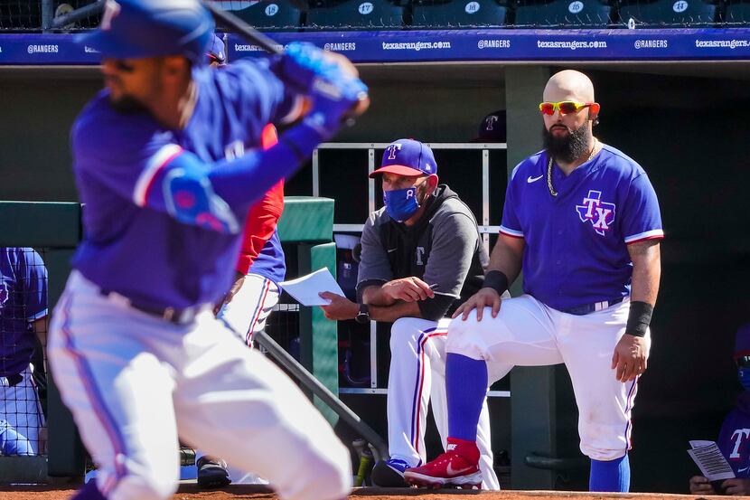 Texas Rangers infielder Rougned Odor (right) watches in the dugout with manager Chris...