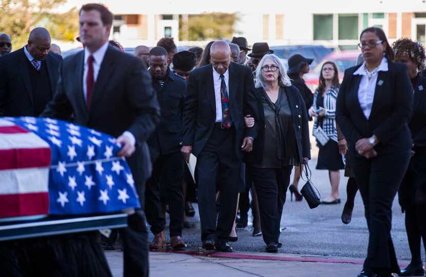 Cousin Volma Overton and his wife Shirley lead their family in to the church before a...