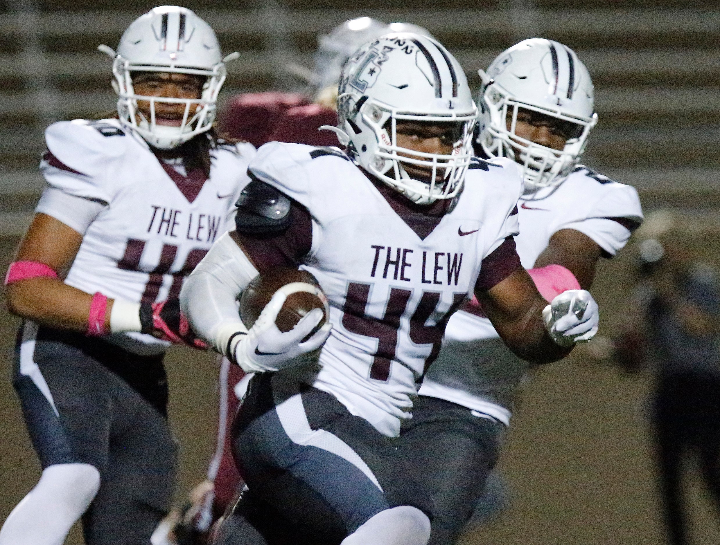 Lewisville High School middle linebacker Mason Johnson (44) rumbles with an interception...