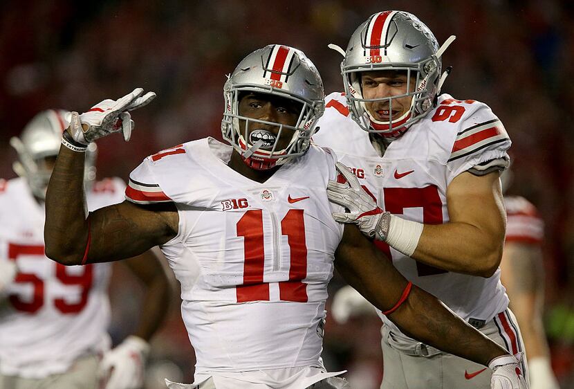 MADISON, WI - OCTOBER 15: Jalyn Holmes #11 and Nick Bosa #97 of the Ohio State Buckeyes...
