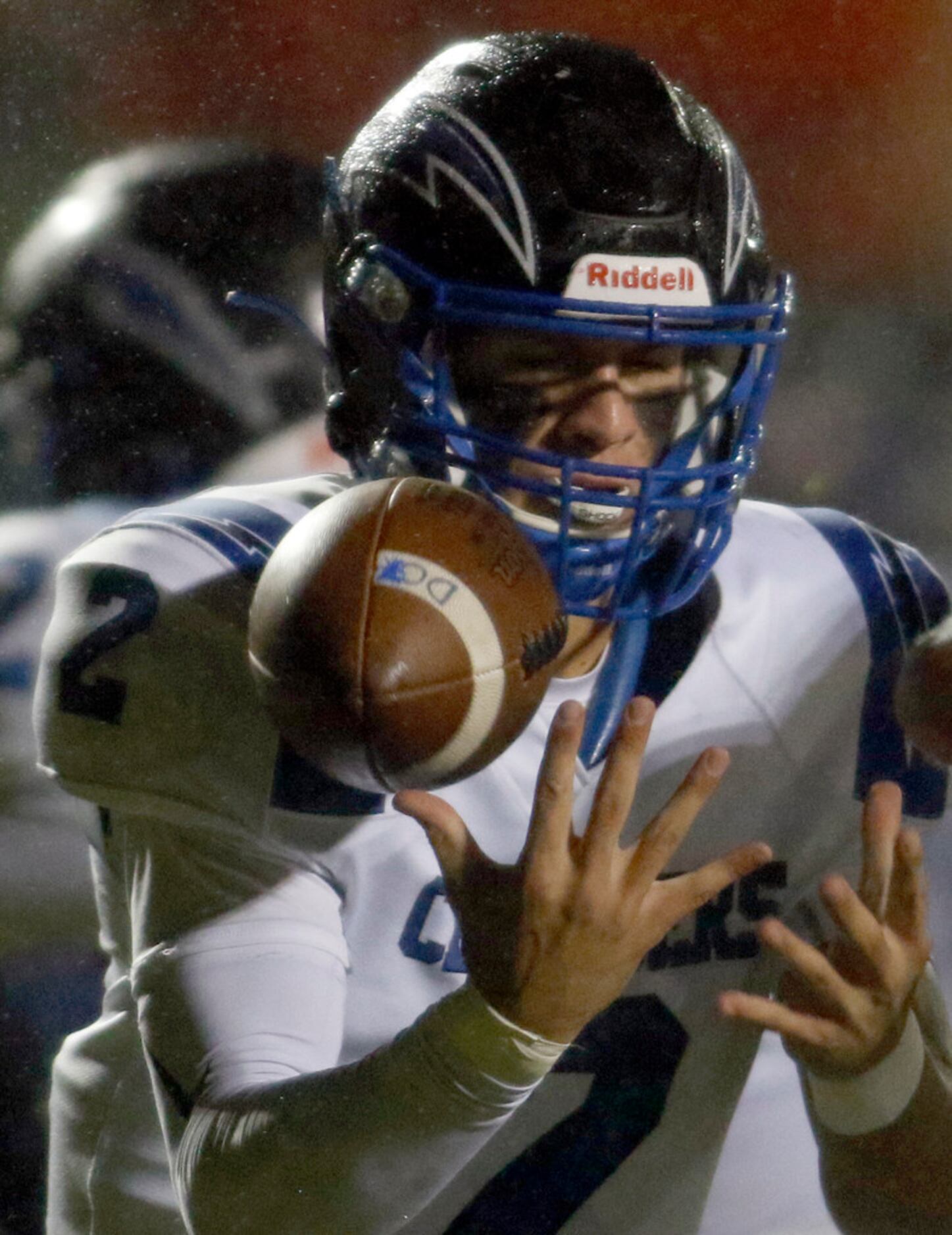 Dallas Christian quarterback Zack Hayland (2) works to get control of a fumbled high snap...