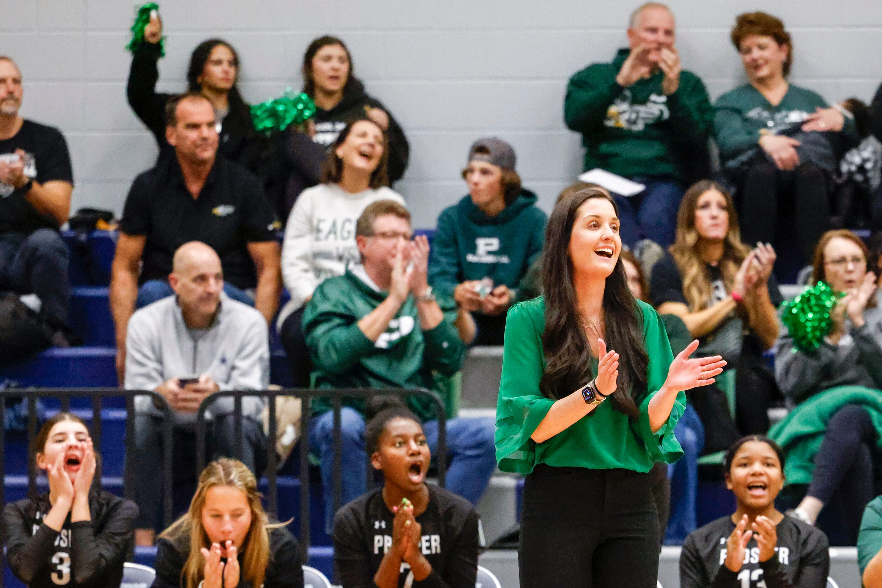 Prosper High’s head coach Ashlee McCormick cheer during class 6A bi-district volleyball...