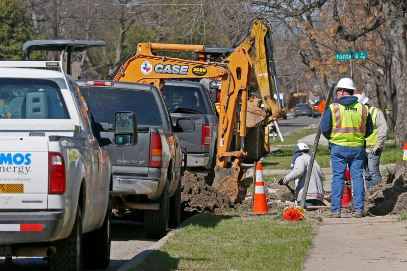 Construction crews work on gas lines on El Centro Drive in Dallas earlier this month.