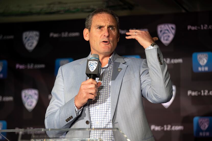 FILE - In this Oct. 8, 2019, file photo, commissioner Larry Scott speaks during the Pac-12...