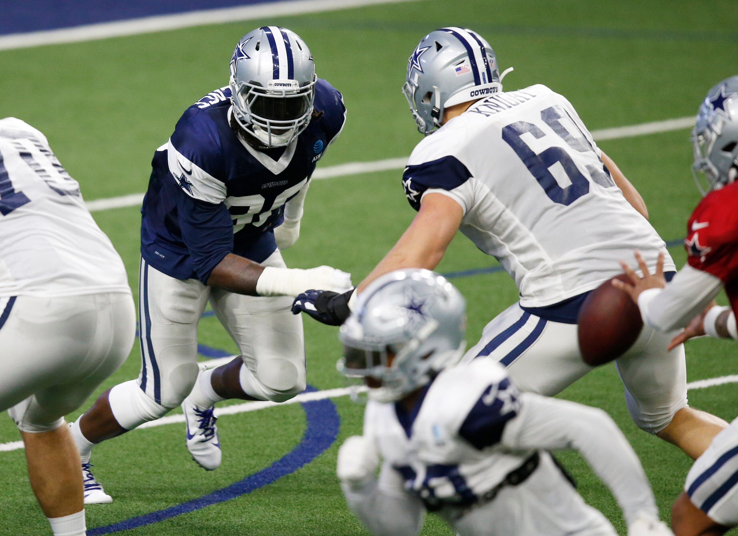 Dallas Cowboys defensive end DeMarcus Lawrence (90) advances towards Dallas Cowboys...