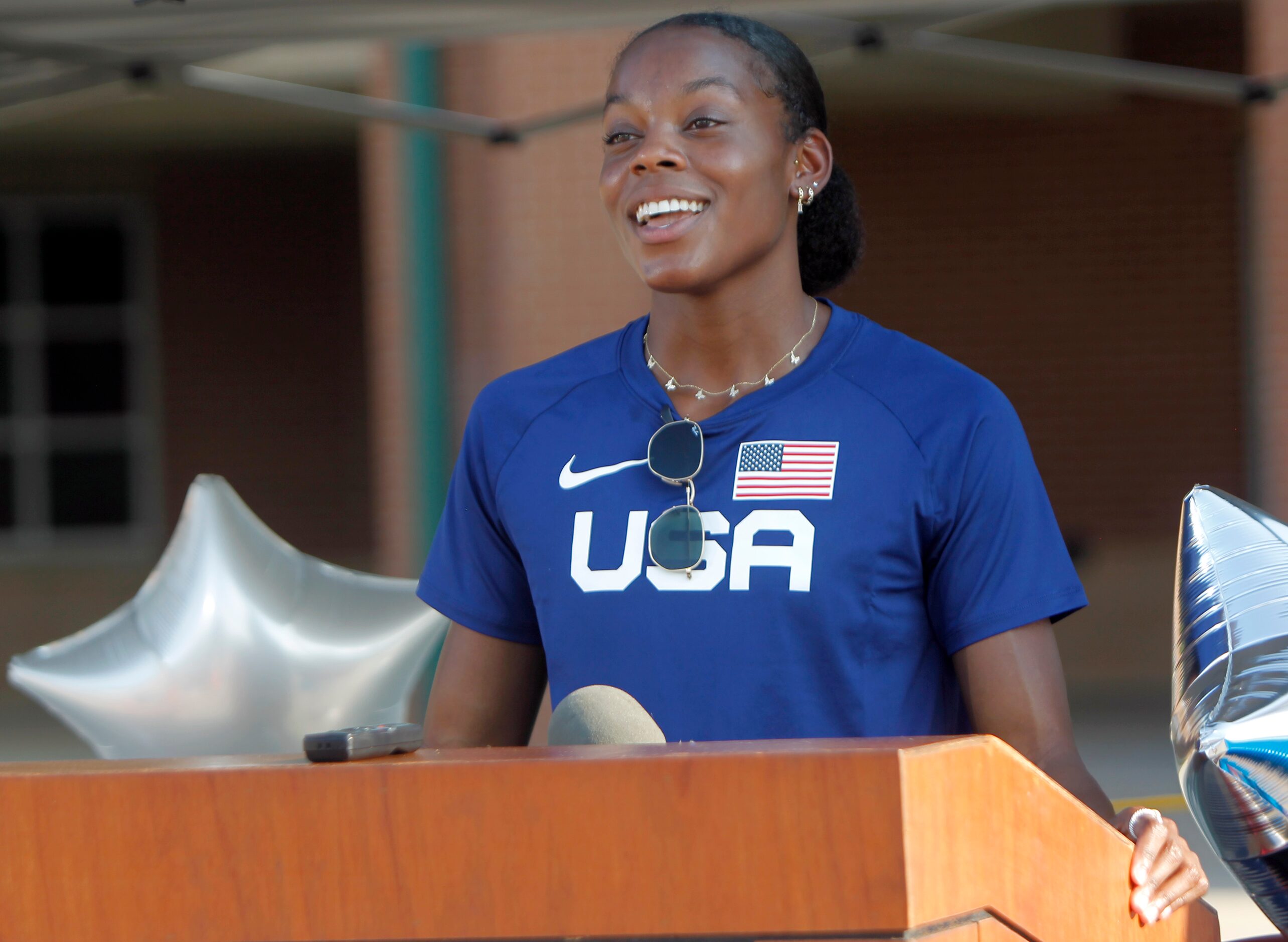 Jasmine Moore responds to a question from a media member during a press conference following...