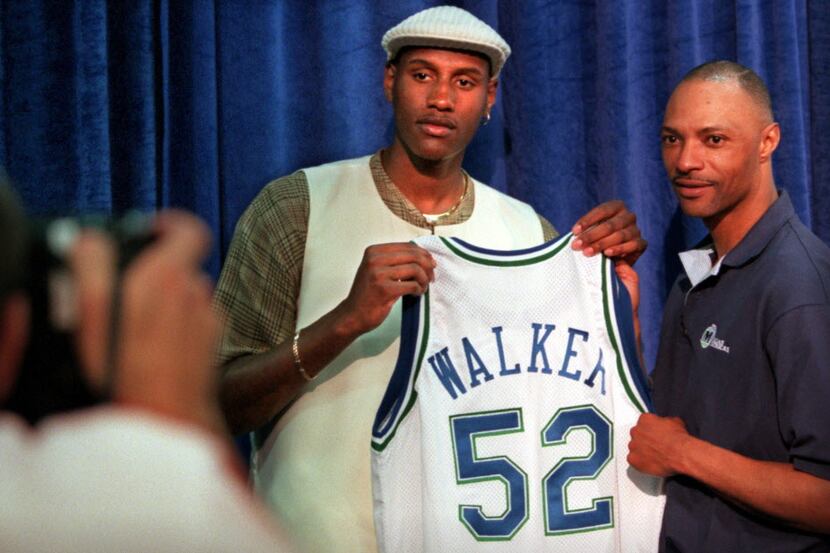 6/27/96--Dallas first-round draft pick  Samaki (cq) Walker poses for a photo with his new...