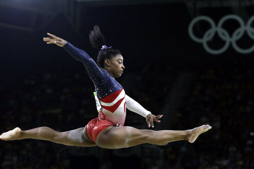 United States' Simone Biles performs on the balance beam during the artistic gymnastics...