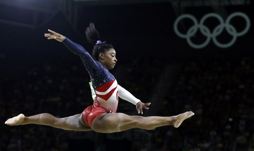 In this Aug. 9, 2016 file photo, United States' Simone Biles performs on the balance beam...