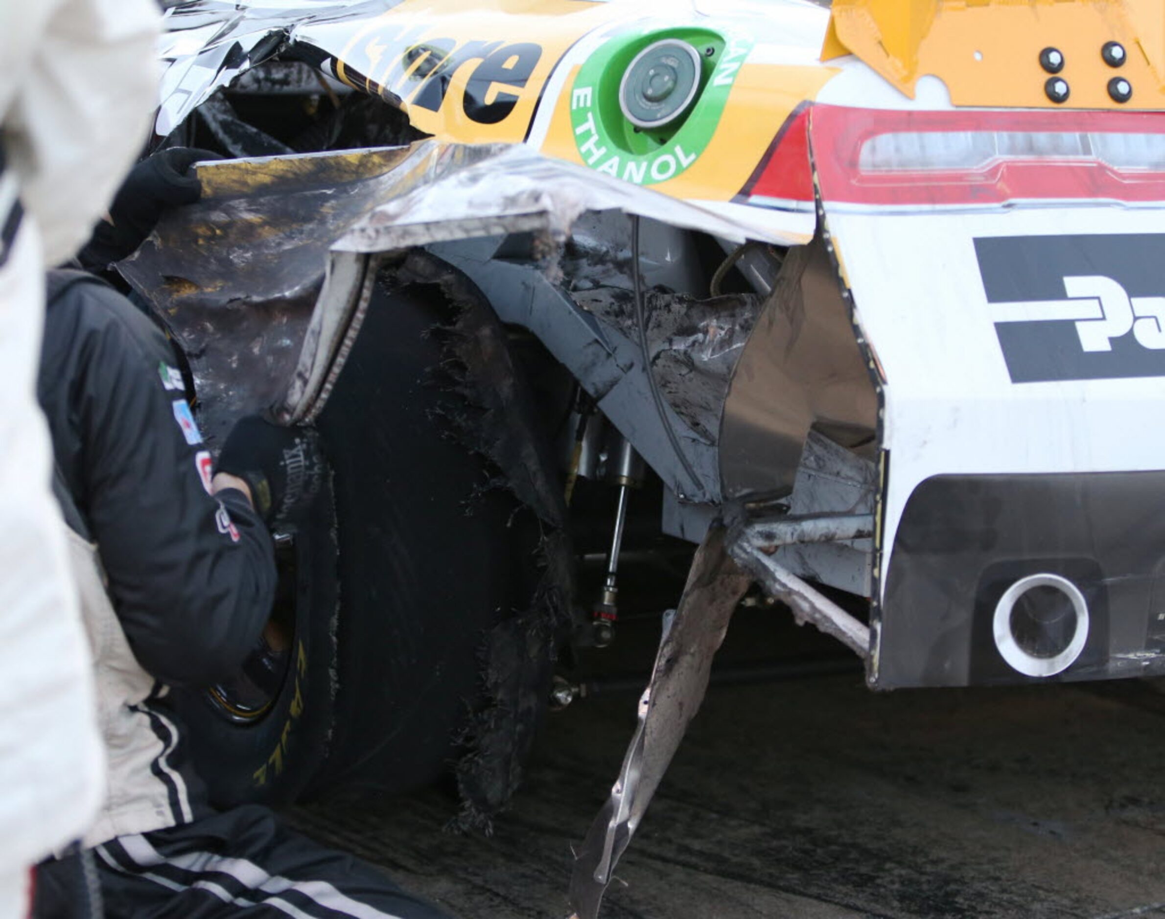 Kyle Larson's (42) blown out tire is worked on by the pit crew during the NASCAR XFINITY...