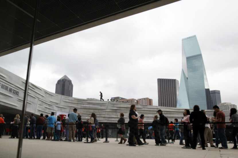 Visitors lined up to enter the Perot Museum of Nature and Science on opening day Saturday....