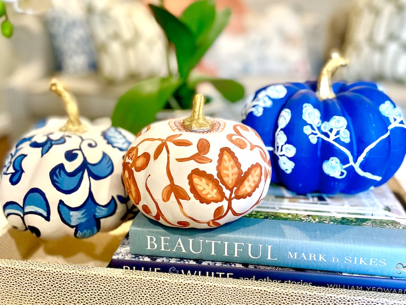 Paint your pumpkins to match your decor, like these designs by Elizabeth Bohannon. Look to...