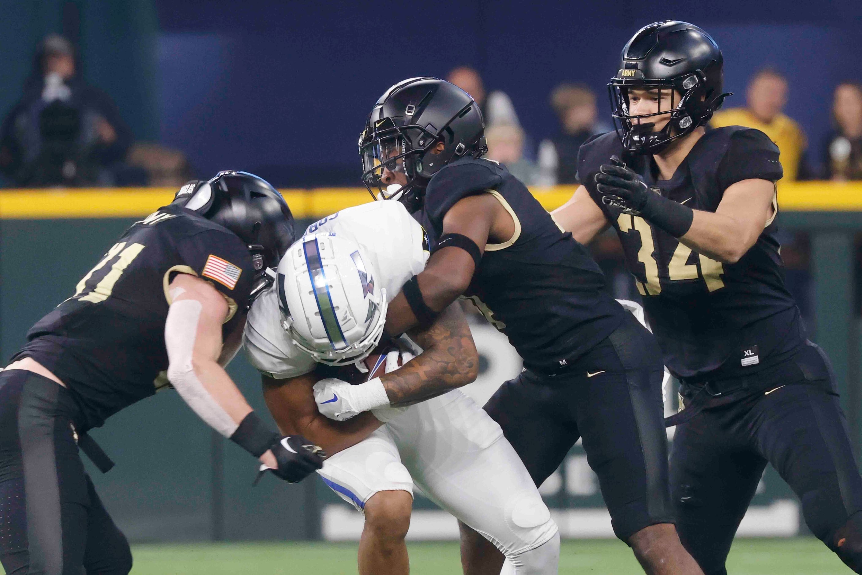 Air Force wide receiver David Cormier (7) gets tackled by Army linebacker Leo Lowin (31),...