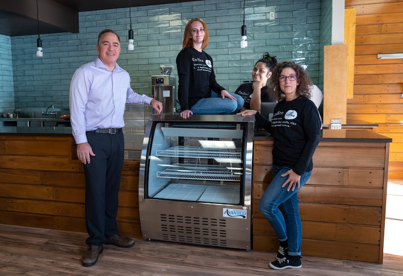 Co-presidents Michael Huscheck (far left) and Natalie Huscheck (far right), with two of...